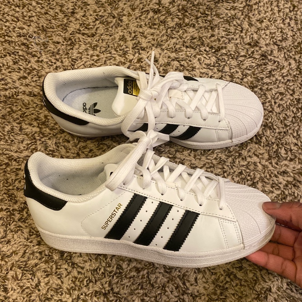 Adidas Superstar white and black stripes.